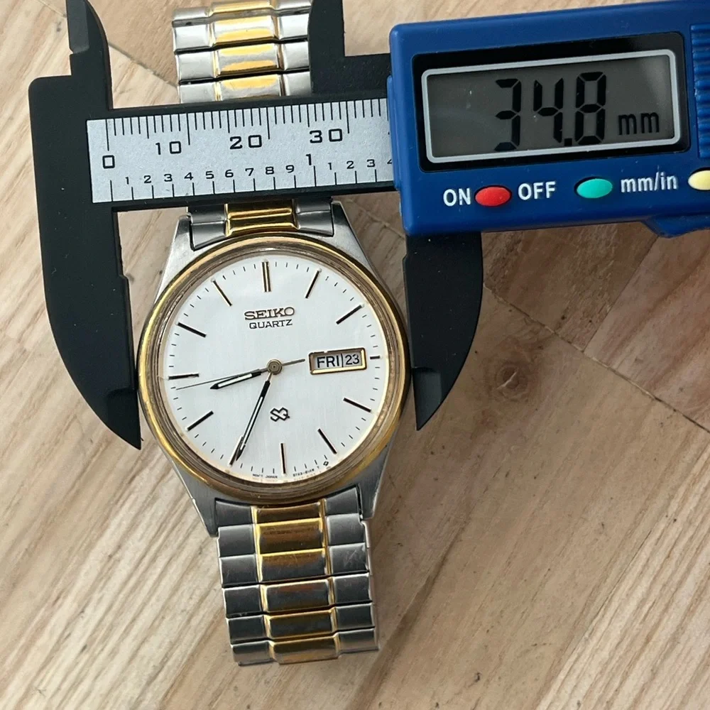 Seiko SQ Vintage Men’s Watch Two-Tone Stretch Bracelet Silver Dial Date Window